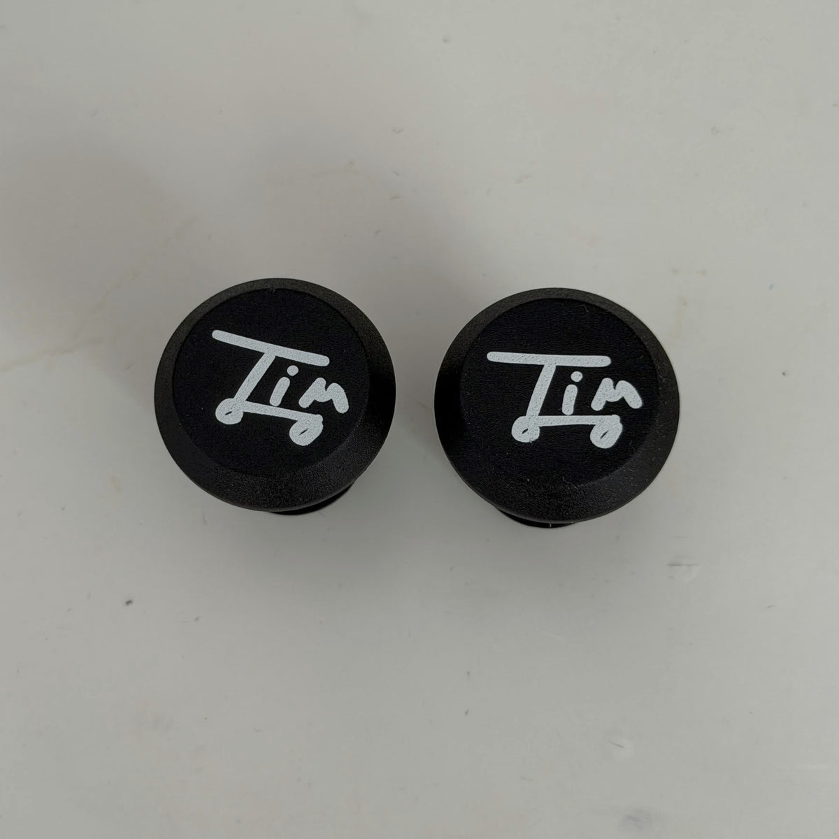 Bouchons de poignées Tim signature