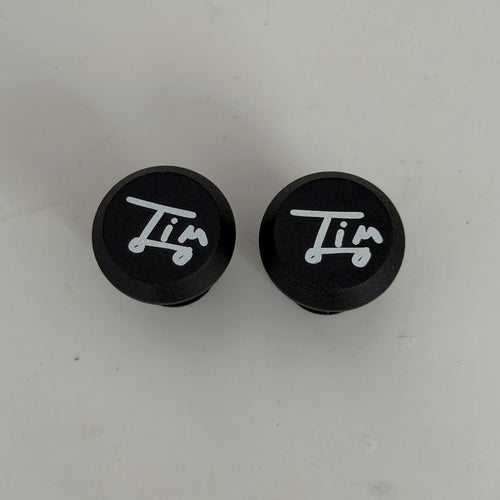 Bouchons de poignées Tim signature